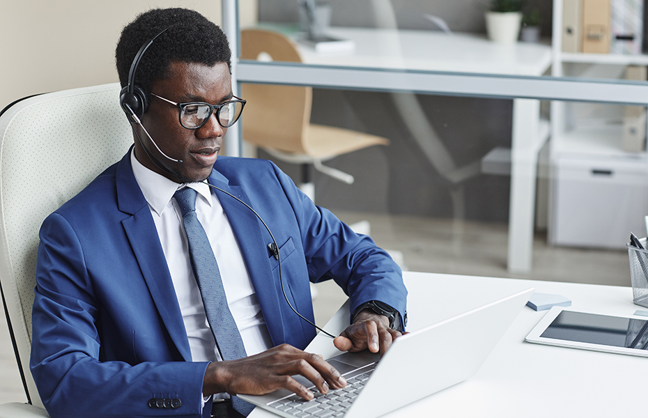 Men working on his laptop as a sales support for answering company