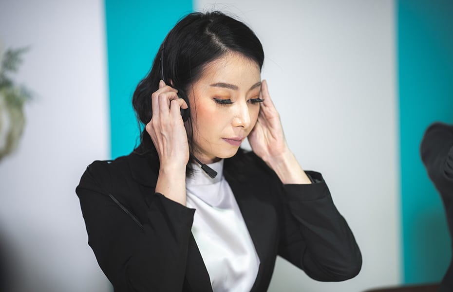 Women working as bilingual agent at answering service company