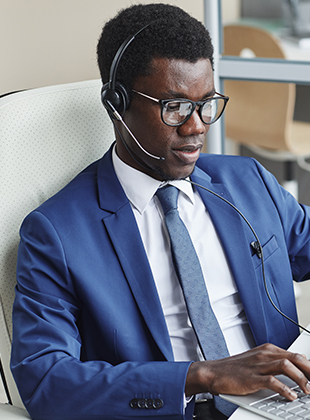 Men working on his laptop as a sales support for answering company
